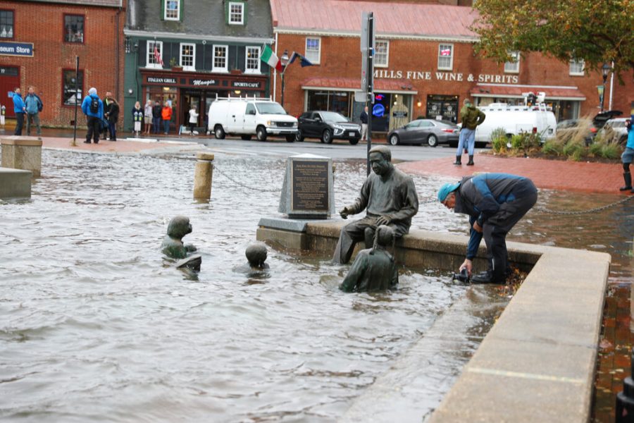 The Kunta Kinte-Alex Haley Memorial and the road behind it are flooded near high tide at City Dock in downtown Annapolis, Md., on Friday, Oct. 29, 2021. The National Weather Service is warning that the mid-Atlantic region could see one of the biggest tidal floods of the last decade or two as heavy rain and winds pummel the region on Friday. (AP Photo/Brian Witte)